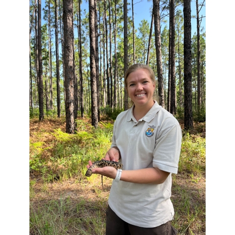 Leah Bleke holds a Louisiana Pine Snake.