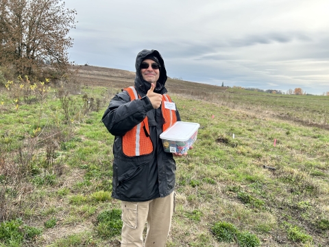 Ankeny National Wildlife Refuge volunteer thumbs up at a planting party