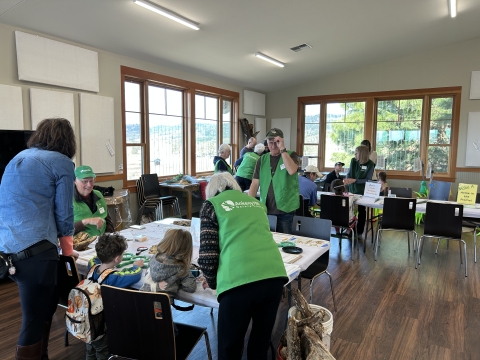 Ankeny Hill Nature Center volunteers coordinating activities with families