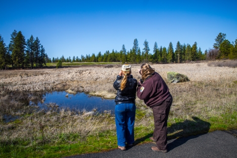 A FWS employee and member of the public go birding together