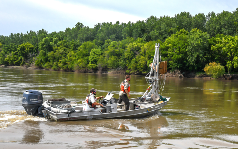 The mechanized bow trawl is positioning to deploy the benthic trawl. 