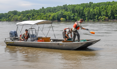 The trawl deployment begins with tossing out the buoy (which is tied to the cod end).