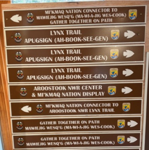Signs pointing visitors to different trails at Aroostook National Wildlife Refuge.