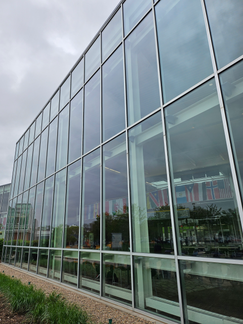 A building on a college campus with clear glass