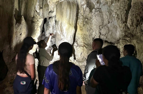 Visitors see Ritidian Beach Cave during Cave Tour