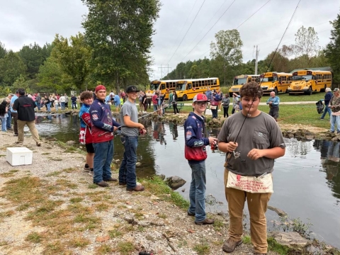 Boys fishing stream