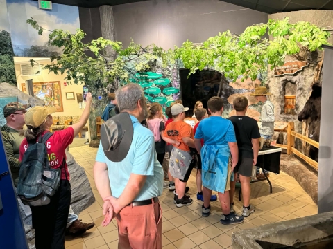 Kids learning at info booth
