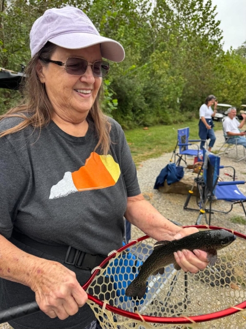 Lady holding fish