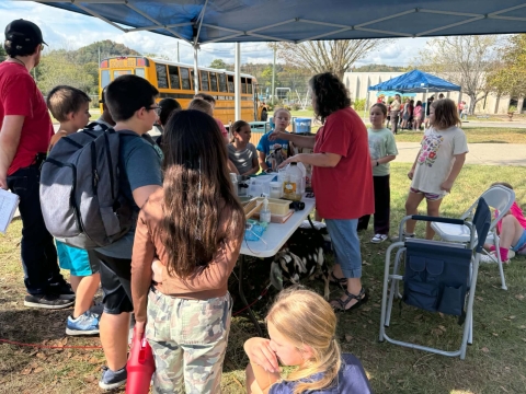 Kids learning at info booth