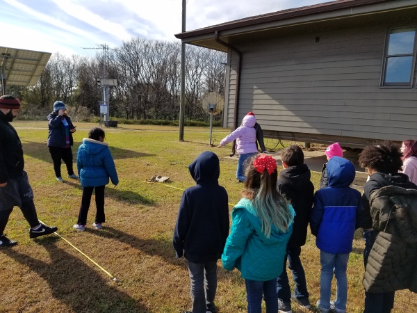 Students participating in an environmental education activity at Back Bay NWR