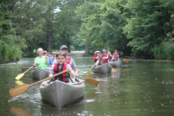 An image of a group of people on a canoe trip.