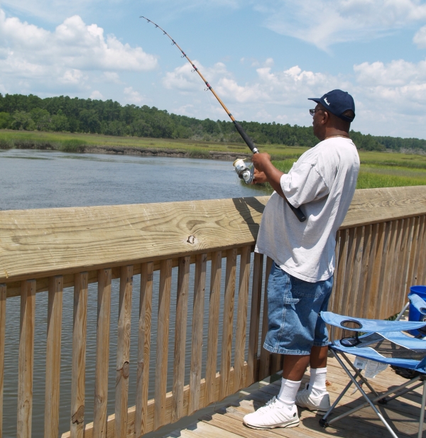 Man fishing off the pier at Harris Neck NWR