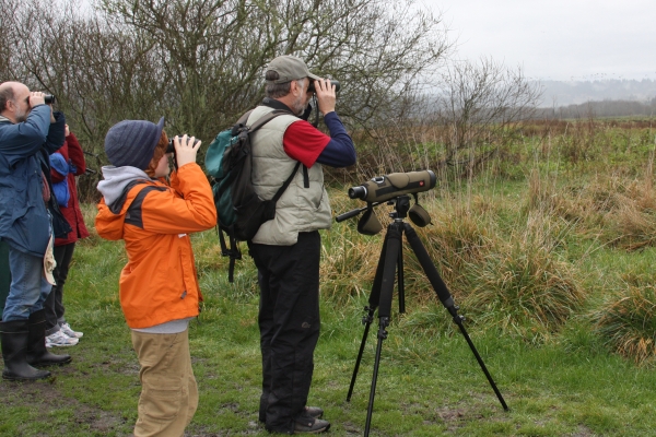 people using binoculars