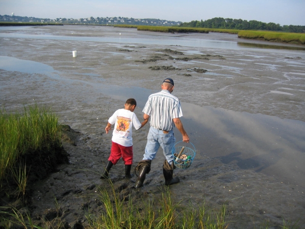 Image of an adult and youth shellfishing