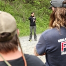 Biologist standing in front of a group, addressing them.