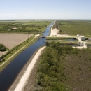 Stream channel running straight across a flat, Florida landscape