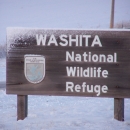 Snow covered entrance sign at Washita National Wildlife Refuge