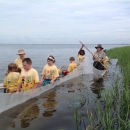 Children exploring Apalachee Bay. They are using a net to look for saltwater creatures.