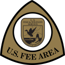 The Federal Recreation Fee Symbol with the FWS Shield in the center. 