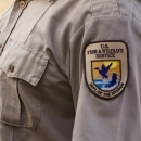 Close up of a USFWS patch on a uniform shirt