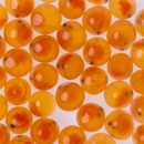 Small orange fish eggs on a white background.