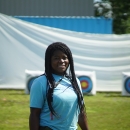 woman standing by archery targets