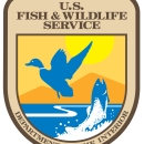 Shield of DOI Fish and Wildlife Service with goose and fish