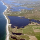 Aerial view of an undeveloped coastal freshwater pond.