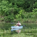 Boater in kayak with Texas wild rice