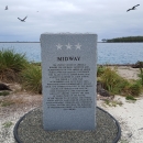 The Midway Memorial Marker with Laysan albatross on background