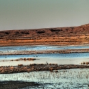 Panorama displaying the waters and brown hills at Bitter Lake National Wildlife Refuge.