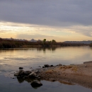 A rocky beach on the water at Havasu National Wildlife Refuge is shown.