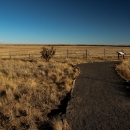 a gravel path through a brown, sandy landscape
