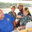 Children learning to make flies