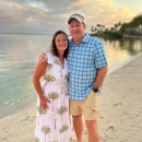 Jeff and his wife standing on the beach