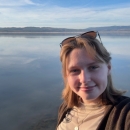 Person standing in front of lake