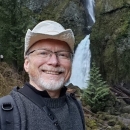 Photo of Michael Green in front of waterfall