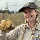 Female park ranger holding a mantis
