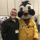 Buddy smiles with a penguin mascot