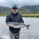 a man holding a salmon