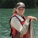 Fish and Wildlife Service Biologist in a life jacket on a boat