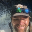Richard Peek on top of a waterfall