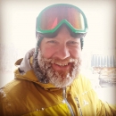 man with ski goggles and icy beard