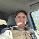 a man in uniform sitting in a car