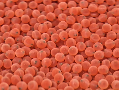 A large collection of tiny pink spheres