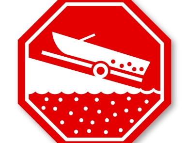 A graphic showing a red stop sign with a boat on a ramp. 