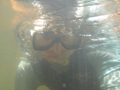 Underwater view of a snorkeler's face