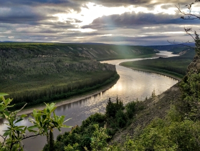 Landscape view over a river and boreal forest