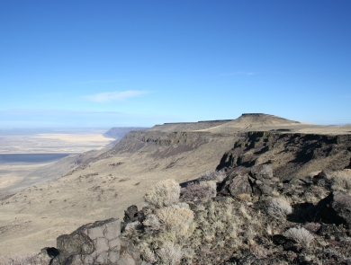 Mountain ridges, sagebrush and distant desert all viewable on a clear day.