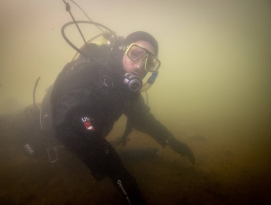 USFWS River diver surveys underwater habitat for freshwater mussels. Photo Credit: Ryan Hagerty/USFWS